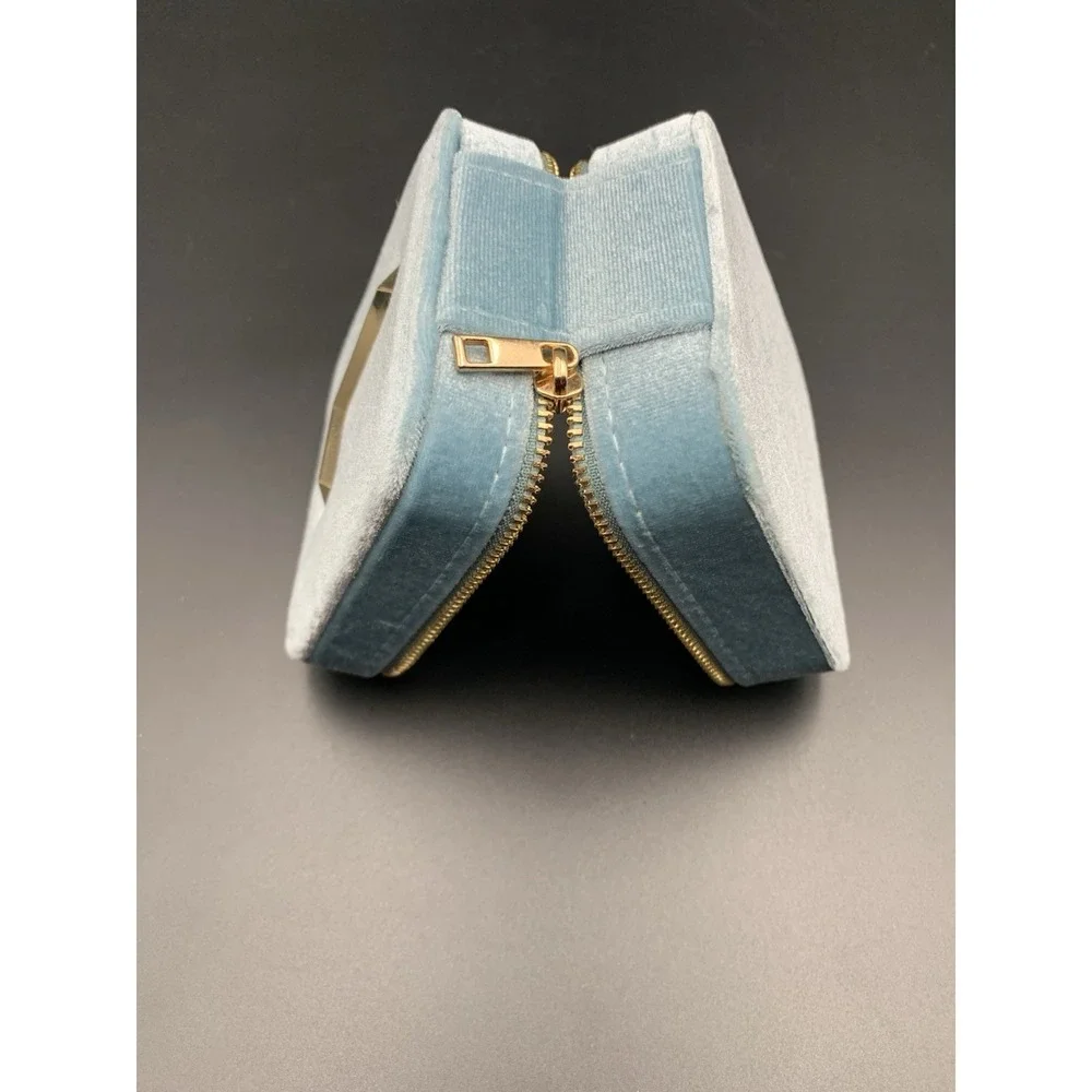 Small blue velvet jewelry box with a zipper